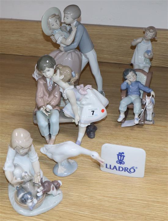 Three Lladro children, two Lladro children groups, a Lladro plaque and a goose (7)